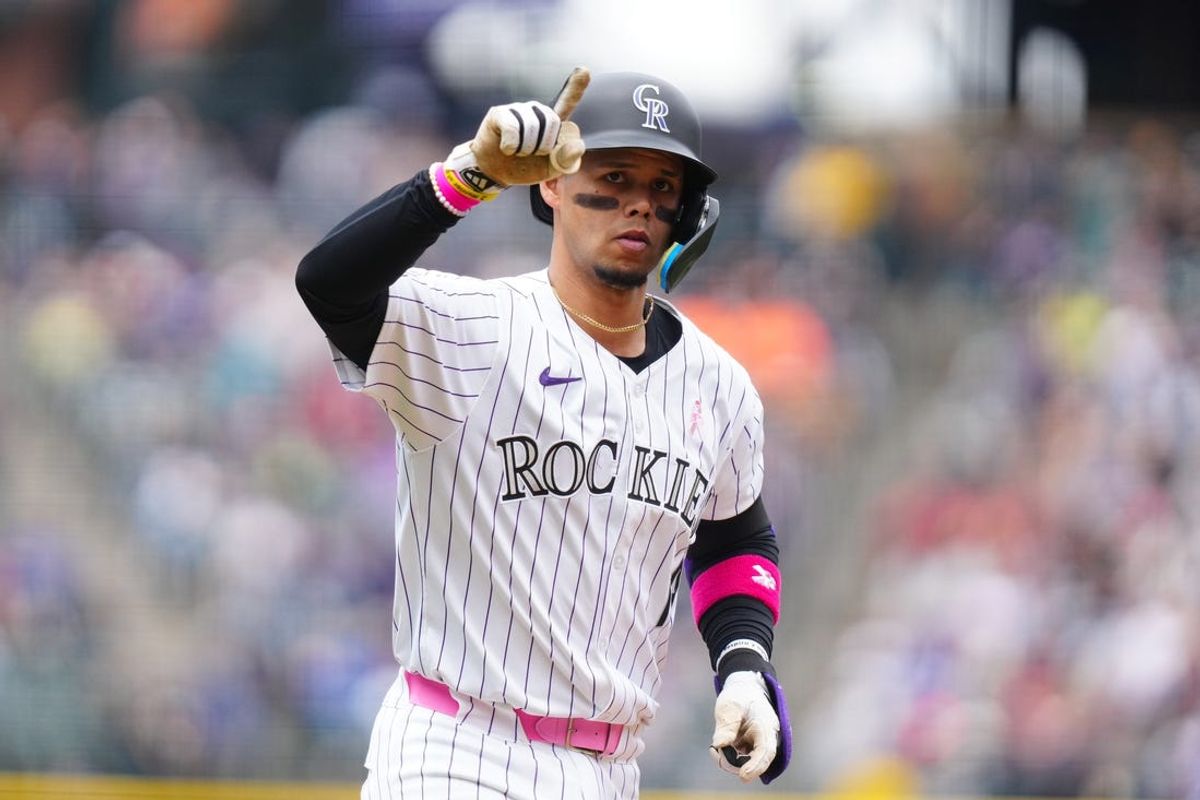 Rockies conclude three-game sweep of Rangers